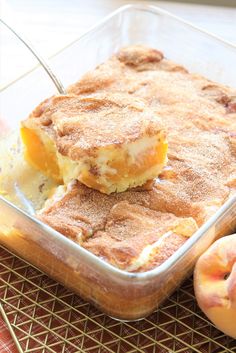 a casserole dish with peaches on the side