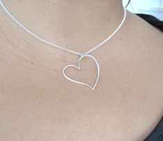 "This Dainty Heart Necklace is a handmade and unique piece. The perfect delicate piece to complement any outfit. This necklace is simply beautiful. We love to use it for couples or as a friendship necklace, it's the perfect piece to express love!❤️ *DETAILS* *Made with: -925 Sterling Silver - -Love *Measurements* - Chain: (16\" standard) -Chain Style: Round Rolo 2 mm. Made in Italy *QUESTIONS?* Any questions that you may have please contact us, we'll be happy to reply, you can send us a message Handmade Minimalist Heart Necklace For Valentine's Day, Cute Heart-shaped Necklaces For Anniversary, Cute Heart Shaped Jewelry For Anniversary, Cute Heart Necklaces For Anniversary, Cute Heart-shaped Jewelry For Anniversary, Cute Heart Charm Jewelry For Weddings, Cute Heart Pendant Necklace For Wedding, Handmade Double Heart Necklace For Wedding, Delicate Sterling Silver Heart Necklace For Valentine's Day