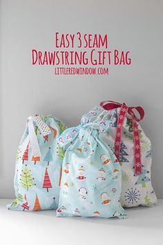 three drawstring bags sitting next to each other on a shelf with the words easy 3 seam drawstring gift bag