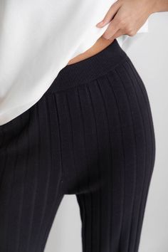 DETAILS Long knit pants High-rise fit Elastic band at the waist Kick flare from the knee No pockets 50% Viscose, 50% Cotton SIZING Our model Marta wears a size S. We suggest S (6/8), M (10/12), L (12/14), XL (14/16). *Please choose carefully, strictly NO return or exchange on FINAL SALE items CARE We recommend washing in a delicates bag and laying flat to dry. Approx garment measurements:These measurements have been taken laying flat. For approximate full measurements please multiply the bust, w Ribbed Elastane Bottoms For Loungewear, Fall Bottoms With Ribbed Waistband And Straight Leg, Stretch Straight Leg Bottoms With Ribbed Waistband, Flare Bottoms With Elastic Waistband For Loungewear, Stretch Wide Leg Pants With Ribbed Waistband For Fall, Fall Loungewear Bottoms With Wide Waistband, Fall Mid-rise Bottoms With Wide Waistband, Black Bottoms With Ribbed Waistband For Fall, Ribbed Black Bottoms For Fall