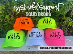 four neon colored hats with the words, need for the beach here for the good works