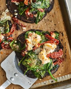 some food is laying out on a baking sheet and ready to be cooked in the oven