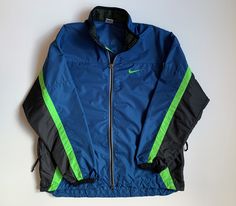 90's Nike Vintage Reflective Clima-fit Windbreacker Men's Jacket Size: L Excellent condition. No stains and holes Please check measurements: - armpit to armpit 66 cm (25,98 inch) - length 77 cm (30,31 inch) - sleeve length from throat 84 cm (33,07 inch) - armpit to cuff 62 cm (22,44 inch) All items are clean, washed. Shipping worldwide: I accept combined worldwide delivery with tracking numbers. Postage: We do the shipment within 2 days. Estimated shipping time: 10-28 working days (in rare cases Sporty Fitted Windbreaker For Outdoor Activities, Fitted Sportswear Windbreaker For Sports, Fitted Windbreaker For Sports, Blue Fitted Sporty Windbreaker, Fitted Green Track Jacket For Sports, Urban Fitted Track Jacket For Sports, Green Sporty Sport Coat, Green Sporty Sport Coat For Outdoor, 90s Green Sports Outerwear