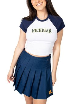 Let everyone know who you root for in this Michigan Wolverines White Homerun Short Sleeve T-Shirt! This Michigan Short Sleeve Tee features a screen print team name on center front. Contrast color sleeves, Contrast color neck band, Finished hemlines, Raglan sleeves, 95% Cotton - 5% Spandex, 4 Stretch Short Sleeve Tops For College, Collegiate Style Fitted Tops For Spring, Stretch Short Sleeve College T-shirt, Summer Collegiate Top For College, Stretch Tops With School Spirit For Summer, Collegiate Crew Neck Stretch Top, Collegiate Stretch Crew Neck Top, Fitted Collegiate Letter Print Top, Fitted Collegiate Top With Letter Print