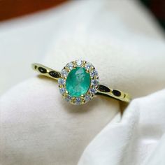 ✦ Discover the allure of nature with our Natural Emerald Ring, adorned with AAA Cubic Zirconia for that extra sparkle. Each gemstone, including the main 4*5mm oval-shaped emerald, is authentic, promising you a piece as unique as you are. Our rings come in a versatile adjustable size, fitting any US ring size, and are crafted from 925 Sterling Silver with options for 18K Platinum, Gold, or Rose Gold Vermeil finishes. Ideal for those born under Taurus or celebrating a May birthday, the emerald sym Emerald Halo, Natural Emerald Rings, May Birthday, Elegant Gothic, Lucky Bracelet, Nose Rings Hoop, Crystal Hoop Earrings, Clover Necklace, Fashion Jewelry Earrings