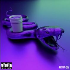 a purple snake with its mouth open next to a cup