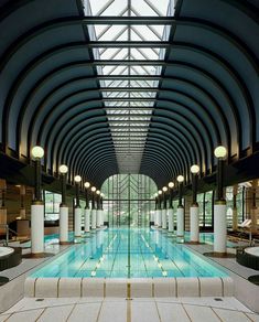 an indoor swimming pool in a large building