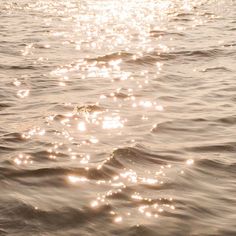 the sun shines brightly on the water as it reflects off the surface of the water