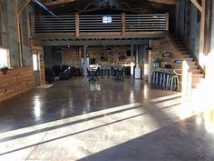 the inside of a barn with wooden walls and ceilings