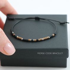 Minimal Custom Morse Code Bracelet. This handmade adjustable bracelet is made of black, bronze seed beads and stainless steel beads. And strong nylon cord. Create custom personalised message in Morse Code!    It is simple but elegant and minimal. Wear yours alone or with a combination of other bracelets.  ◆  Bracelet is adjustable 6.5'' to 10'' (16.5 cm-25.4 cm). This bracelet is adjustable size with a sliding knot and will fit most wrists. If you need a larger or a shorter size let me know i wi Loss Of Son, Code Morse, Loss Of Mother, Message Bracelet, Toho Beads, Morse Code Bracelet, Morse Code, Sliding Knot, Hematite Beads