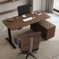 an office desk with a laptop on it