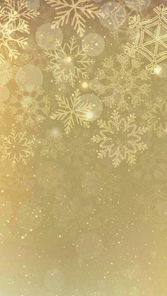 snowflakes are on the ground in front of a gold background