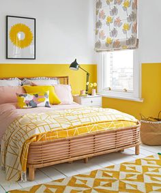 a bedroom with yellow walls and white flooring is decorated in shades of pink, orange, and yellow