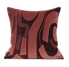 a pillow with the letter c on it in red and brown velvete, against a white background