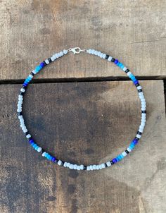 Blue Skies Serape Necklace! Beaded necklace that features silver platted clasps to help prevent tarnish. Also features a double O-Ring to ensure the necklace stays closed and secure. Length: 14 In Blue Jewelry With Lobster Clasp For Festival, Blue Beaded Necklaces With Lobster Clasp For Festival, Blue Beaded Necklace For Festival With Lobster Clasp, Blue Single Strand Choker Jewelry, Blue Single Strand Choker For Gift, Adjustable Blue Beaded Necklace With Lobster Clasp, Adjustable Blue Necklace With Silver Beads, Blue Single Strand Beaded Necklace For Festival, Adjustable Blue Single Strand Choker