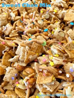 a pile of sweet chex mix with sprinkles and candies on top