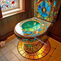 a stained glass toilet with the lid up