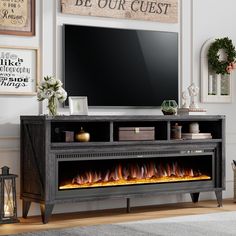 an entertainment center with a fireplace in the middle