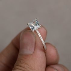 This is a gorgeous handmade creation. Its beauty is its simplicity & Elegance. The 6*6mm princess cut shape faceted aquamarine is crafted in solid sterling silver and with rhodium plated. All item is sent in a beautiful gift box You can realize more lovely stuff clicking the link https://www.etsy.com/shop/knightjewelry?refshopsection_shophome_leftnav Please leave the correct address and you phone number for delivering successfully. Princess Cut Diamond Ring As Gift, Rectangular Aquamarine Jewelry For Wedding, Rectangular Aquamarine Wedding Jewelry, Rectangular Diamond Topaz Ring For Gift, Rectangular Topaz Ring With Diamond, White Topaz Jewelry With Princess Diamond Cut, Gift Square Cut Topaz Ring With Prong Setting, White Topaz Jewelry With Princess And Diamond Cuts, Square Cut Topaz Ring With Prong Setting As Gift