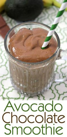 chocolate smoothie in a glass with a green and white striped straw