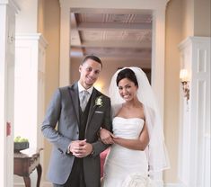 a bride and groom posing for the camera