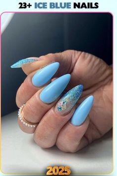 Frosty ice blue nails with glitter details, inspired by winter magic. A festive and chic choice for holiday celebrations or seasonal styles.