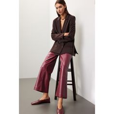 Red faux leather (100% Polyurethane faux leather). Pants. Front zipper closure. 28" inseam. 11.5" rise. Imported. Sleek Wide-leg Leather Pants For Fall, Faux Leather Wide-leg Pants For Fall, Fall Wide-leg Faux Leather Pants, Sleek Leather Bottoms For Fall, Brown Office Pants For Fall, Fall Wide Leg Faux Leather Pants, Fall Brown Wide-leg Leather Pants, Fall Faux Leather Wide-leg Pants, Trendy Leather Bottoms For Business Casual