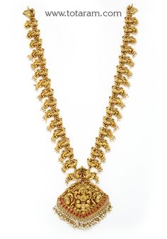 22 Karat Gold "Lakshmi - Peacock" Long Necklace with  Pearls & Beads (Temple Jewellery)

Introducing our exquisite 22 Karat Gold "Lakshmi - Peacock" Long Necklace with Pearls & Beads, a truly captivating piece of temple jewellery. Crafted with utmost precision and artistry in India, this necklace is a testament to the rich heritage of Indian gold jewellery.
 
 Made with 22 Karat Gold, this necklace exudes luxury and elegance. Its intricate design, featuring a stunning Lakshmi and Peacock motif, Luxury Temple Jewelry With Polished Beads, Luxury Gold Long Temple Necklace, Luxury Temple Jewelry Beaded Necklaces For Festive Season, Luxury Long Temple Necklace For Celebration, Luxury Filigree Temple Necklace For Diwali, Luxury Hallmarked Temple Necklace For Festivities, Luxury Temple Necklace With Peacock Design, Luxury Gold Temple Jewelry Beads, Luxury Beaded Temple Jewelry