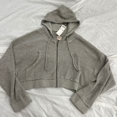 Urban Outfitters Bdg Leah Waffle Knit Zip-Up Hoodie Sweatshirt Size Small Condition: Nwt Color: Grey Details : - Classic Hoodie Silhouette In Ultra-Soft Waffle Thermal Knit. - Zip-Up Hoodie Style - Cropped To The Waist And Cut In An Easy Relaxed Fit With A Cozy Hood And A Zip Closure At The Front. - With Side Pockets. - Thermal Sweatshirt In A Loose, Cropped Fit Extra: - I Ship Between 1-2 Days Urban Outfitters Fall Hoodie With Drawstring Hood, Urban Outfitters Fall Hoodie Sweatshirt, Waffle Knit Long Sleeve Sweatshirt For Streetwear, Streetwear Long Sleeve Waffle Knit Sweatshirt, Casual Knit Sweatshirt With Drawstring Hood, Long Sleeve Waffle Knit Sweatshirt For Streetwear, Casual Cotton Hoodie With Soft Knit, Casual Hooded Sweatshirt By Urban Outfitters, Casual Hoodie Sweatshirt By Urban Outfitters