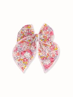 The perfect accessory for everyday or party look. 100% cotton Liberty of London fabric in Tana Lawn pink and purple floral print. Silver-tone alligator clip with teeth. The bow measures approximately 4.5 x 5.0 inches * Due to the nature of our handmade bows each bow may look slightly different. * This hair accessory is not a toy, we recommend not to play with it. It may contain small parts that potentially could be dangerous to small children, please supervise your child while wearing our hair a Pink Hair Bow Accessories For Spring, Pink Ribbon Bow For Spring, Spring Pink Hair Accessories With Bow, Cute Pink Summer Bow, Cute Cotton Bow Hair Accessories, Playful Pink Hair Accessories With Bow, Liberty Of London Fabric, Purple Floral Print, Party Look