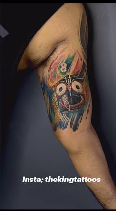 a man with a colorful tattoo on his arm