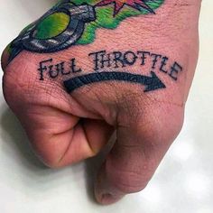 a person with a tattoo on their hand that says full trottie and an arrow