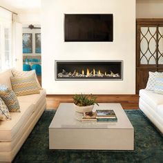 a living room with two couches and a fireplace