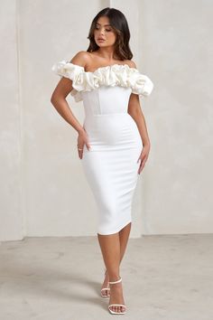 Make an elegant entrance at that upcoming wedding in our eye-catching Estie midi dress. Crafted from a white crepe that's both luxurious and sculpting. this bodycon dress boasts a statement Bardot neckline with a voluminous puff trim that wraps into draped sleeves. Complement Estie's classic design with diamond earrings and strappy silver heels.Features- Premium stretch crepe- Bardot neckline - Statement puff trim- Off-shoulder sleeves- Bodycon fit- Invisible zip closure- Split hemline- Midi len