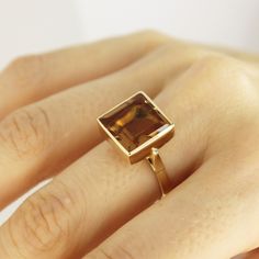 Square Zultanite Ring 14k Gold Real Rectangle Sultanite Gemstone Ring Color Changing Zultanite Ring Wedding Band Christmas Anniversary Gift ▶ 𝙋𝙍𝙊𝘿𝙐𝘾𝙏 𝙁𝙀𝘼𝙏𝙐𝙍𝙀𝙎 * 14k Solid Gold Ring * Zultanite Gemstone Ring Width: 1.20 cm ( 0.47 inches) * Zultanite Gemstone Ring Lenght: 1.20 cm ( 0.47 inches) * Zultanite Gemstone Ring Height: 7 mm ( 0.27 inches) - Our Zultanite ring is real and natural stone. You can tell from the color change that it is original. It is not lab made. Zultanite sto Modern Gold Topaz Ring In Rectangular Shape, Gold Radiant Cut Sapphire Ring Gift, Modern Yellow Gold Topaz Ring With Rectangular Shape, Gold Sapphire Ring With Radiant Cut For Gift, Modern Topaz Ring With Rectangular Stone For Formal Occasions, Modern Gold Rectangular Topaz Ring, Modern Formal Topaz Ring With Rectangular Stone, Formal Rectangular Fine Jewelry Gemstones, Rectangular Topaz Ring In 14k Gold