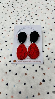 Handmade red and black pattern polymer clay statement earrings. All of my earrings are made out of polymer clay and using 925 sterling silver findings. My polymer clay earrings are handmade in United Kingdom; Please bear in mind that the earrings that you will receive may differ slightly from the image and there may be minor imperfections in each piece. That is why you are going to receive and have a modern, different and unique pair of earrings! Colours on computers monitors and screens may vary; so if you have any questions about these earrings, please send me a message prior to purchase and I will be honoured to give you the most detailed description I can. All the items will be posted in a large letter box and send via Royal Mail 1st Class; and if you order comes from UK it will be fre Handmade Red Polymer Clay Earrings, Red Drop Earrings In Polymer Clay, Red Polymer Clay Dangle Jewelry, Red Polymer Clay Drop Earrings, Hand Painted Red Polymer Clay Earrings, Red Hand Painted Polymer Clay Earrings, Elegant Red Polymer Clay Earrings, Everyday Red Polymer Clay Jewelry, Trendy Red Hand Painted Earrings