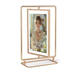 a gold metal frame with a photo on it