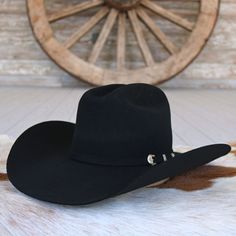 This wool Ariat hat from M&F Western Products will certainly elevate your style. Its superior quality is evident, making it a favorite accessory to wear. The hat boasts a self-band with a three-piece buckle set and a genuine leather sweatband.    Brim: 4-1/4"  Crown: 4-1/4"  Color- Black  3x Wool Ariat Hats, Beaded Hat Bands, Kids Belt, Beaded Hat, Feather Hat, Outdoor Hats, Leather Hats, M F, Hat Band