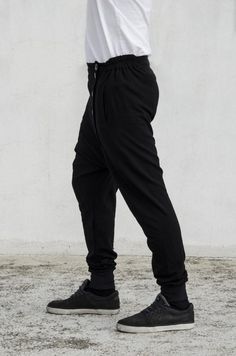 Panelled drop crotch joggers with 5 buttons offset closure & elastic waistband[] ENJOY FREE SHIPPING []> Place an order of 150€ minimum items’ value> Add coupon code VMFREESHIP at checkout> Benefit from free shipping[] EXTRA BENEFITS []> All orders above 25€ win a “Thank you” 10% discount coupon available for the next order> All orders receive special surprise gifts.[] GREEK CUSTOMERS []Buyers from Greece are advised to visit the official VOIDmode shop > (http://bit.ly/VOID Sporty Sweatpants With Tapered Leg, Urban Streetwear Bottoms With Ribbed Waistband, Sporty Tapered Leg Sweatpants With Loosely Fitted Hips, Sportswear Bottoms With Hip Pockets For Streetwear, Urban Bottoms With Ribbed Waistband For Streetwear, Sporty Loosely Fitted Tapered Leg Sweatpants, Sportswear Bottoms With Side Pockets For Streetwear, Sportswear Bottoms With Side Pockets, Casual Harem Pants With Elastic Waistband For Sports