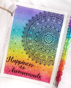 a card with the words happiness is homemade on it next to beads and a bead