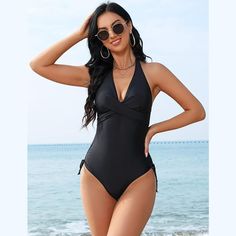 Elevate your swimwear collection with this Women's Halter Swimsuit. This one-piece tankini features a front twist detail and a deep V neckline, creating a stylish and flattering look. The side ruching adds a touch of elegance to the design, making it a perfect choice for your summer 2024 adventures. Crafted from a blend of 82% polyester and 18% spandex, this swimsuit offers a comfortable and stretchy fit that moves with you. Available in three trendy styles and colors: Black, Camouflage Rose, an Solid Swimwear With Twist Front For Vacation, Ruched Halter Neck Swimwear For Beach Season, Summer Swimwear With Twist Front For Sunbathing, Beach Season Swimwear With Twist Front For Sunbathing, Summer Twist Front Swimwear For Sunbathing, Beach Season Twist Front Swimwear For Sunbathing, Beachwear Tankini With Twist Front For Beach, Beachwear Tankini With Twist Front, Beachwear Tankini With Twist Front Detail