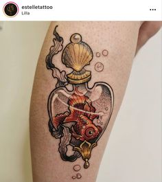 a goldfish in a heart shaped bottle tattoo on the right thigh and lower leg