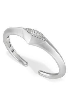 Round-cut diamonds add brilliant shine to a sleek cuff bracelet finished in satin polish. 2" width Total diamond weight: 0.73ct. Rhodium plate/sterling silver/diamond Imported Diamond Guide Modern Diamond Cut Bracelet For Anniversary, Modern Cuff Bracelet With Diamond Accents For Formal Events, Modern Diamond Bangle Bracelet, Modern Cubic Zirconia Diamond Bracelet, Modern Polished Faux Diamond Bracelet, Modern Silver Diamond Bracelet With Pave Setting, Modern Silver Diamond Bracelet With Diamond Cut, Modern Diamond Bracelet With Single Cut Diamonds, Modern Diamond Bangle With Polished Finish