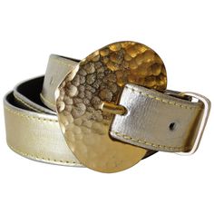 Elevate your outfit with this Yves Saint Laurent belt from the 1980s! Gold metallic leather belt with gold hammered belt-buckle. Marked a size medium. Measures 34 inches total. Yves Saint Laurent Belt, Belts 2023, Saint Laurent Belt, Vintage Belts, Stone Gold, The 1980s, Multi Stone, Metallic Leather, Metal Buckles