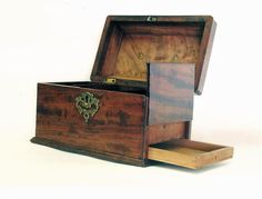 an old wooden box with two drawers open