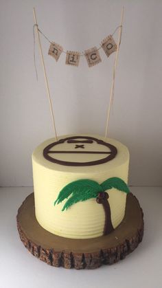 a birthday cake with a palm tree on top