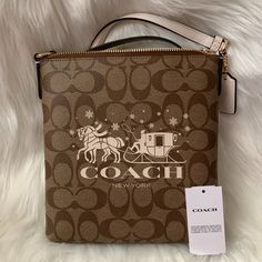 Coach Signature Mini Rowan File Crossbody Bag *New With Tags *Khaki Signature Printed Pvc With Chalk White Leather Trim Exterior *Chalk White Coach Horse And Carriage Printed Graphic Front *Camel Nylon Interior *Interior: (1) Slip Slot *Exterior: (1) Zip Slot *Top Zip Closure, Gold-Tone Hardware *Mini Chalk White Leather Coach Hangtag *Approximate Dimensions: 8.5" X 7.5" X 1" Coach Cream Bag As Gift, Cream Coach Bag As Gift, Coach Cream Bag Perfect For Gifts, Coach Cream Bag For Gift, Coach Crossbody Shoulder Bag For Gift, Coach Crossbody Shoulder Bag Gift, Coach Cream Pouch Shoulder Bag, Coach Cream Crossbody Bag, Coach Tan Gold Limited Edition