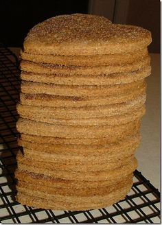 a stack of cookies sitting on top of a cooling rack