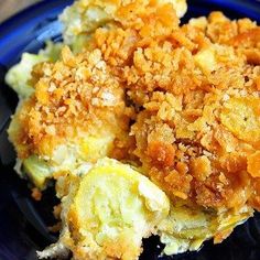 a close up of a plate of food with broccoli and bread crumbs