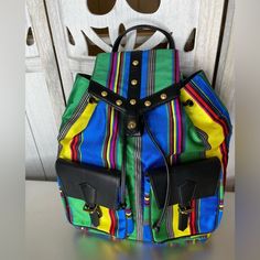 Elevate Your Fashion Game With This Stunning Versace Retro Striped Colorful Backpack Bag! This Beautiful Bag Boasts A Stylish Striped Pattern In Vibrant, Eye-Catching Colors That Are Sure To Turn Heads Wherever You Go. Made From High-Quality Canvas And Leather Materials, This Backpack Is Both Durable And Fashionable, Perfect For Any Occasion. Featuring A Drawstring Closure And Black Leather Handles/Straps With Gold Hardware Accents, This Backpack Is Both Functional And Fashionable. The Interior Is Lined With Luxurious Black Leather And Features A Brand Card For Authenticity. With Its Vintage Style And Colorful Design, This Versace Backpack Is A Must-Have For Any Fashion-Forward Woman. Ov Luxury Multicolor Satchel For Travel, Designer Multicolor Satchel For Travel, Designer Multicolor Travel Bags, Luxury Multicolor Everyday Bags, Designer Multicolor Everyday Bag, Luxury Multicolor Travel Bags, Luxury Blue School Bag, Multicolor Backpack With Removable Pouch, Multicolor Standard Backpack With Removable Pouch